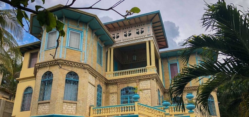 a restored old colonial house with many decorative details