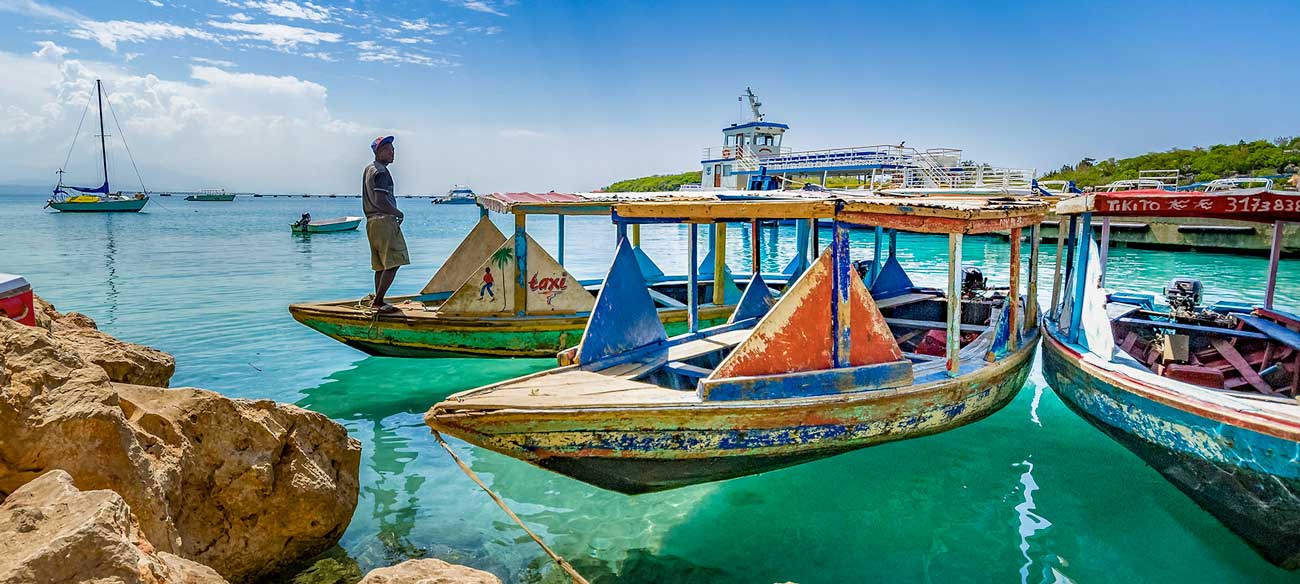 Colorful boat taxis line the shore at Cap-Haïtien, Haiti