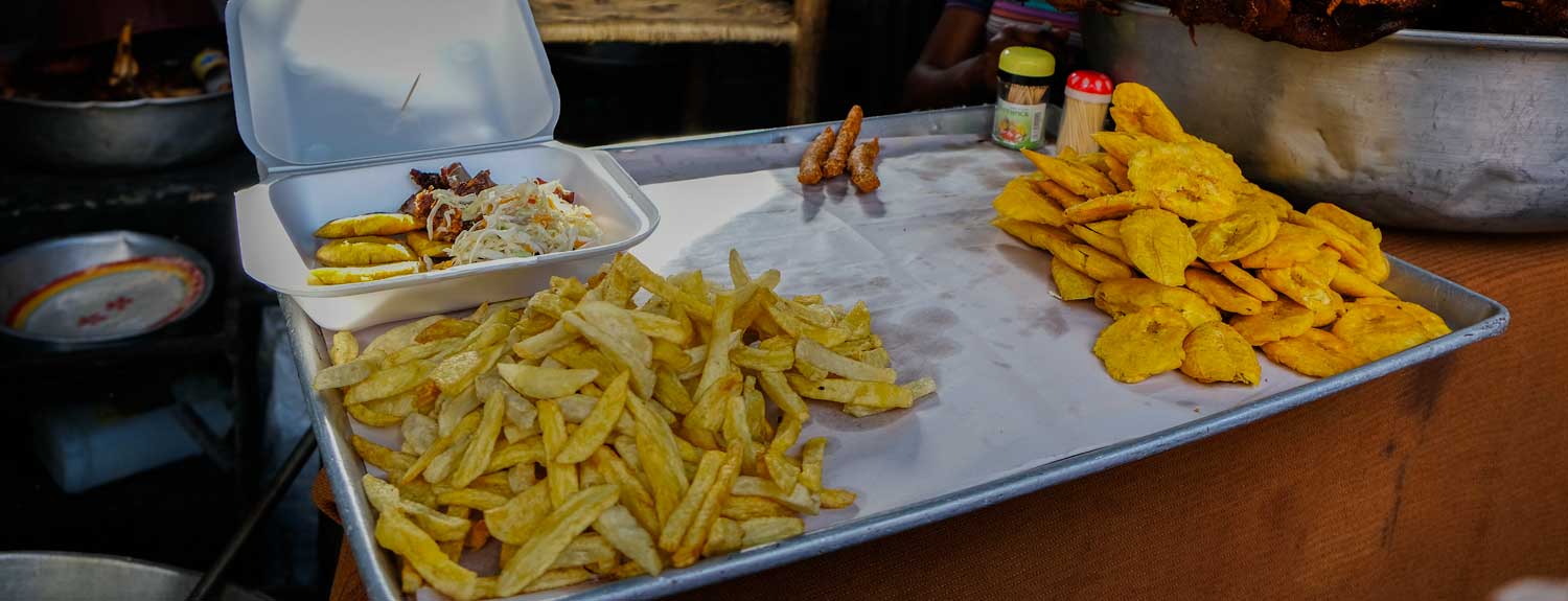 Fritay - fried chips and plantains - on display at a street food stall in Haiti