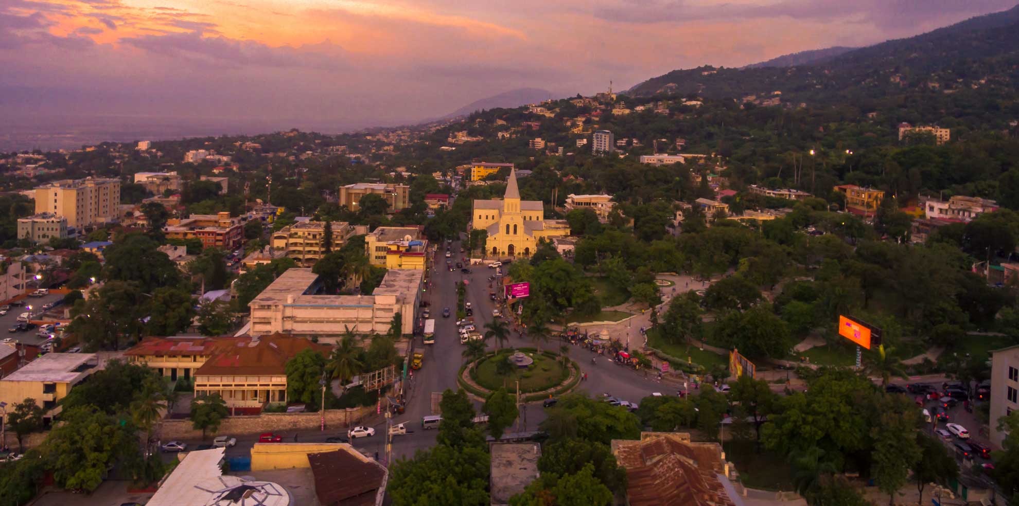 Stop to smell the roses at Place Saint-Pierre · Visit Haiti