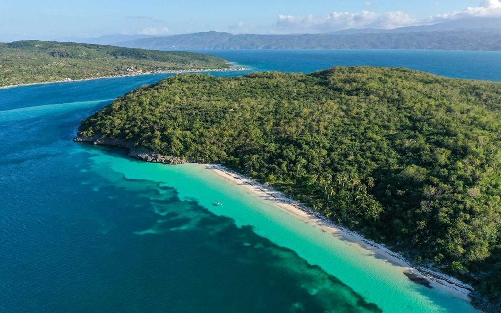 secluded haitian island with forest and beach