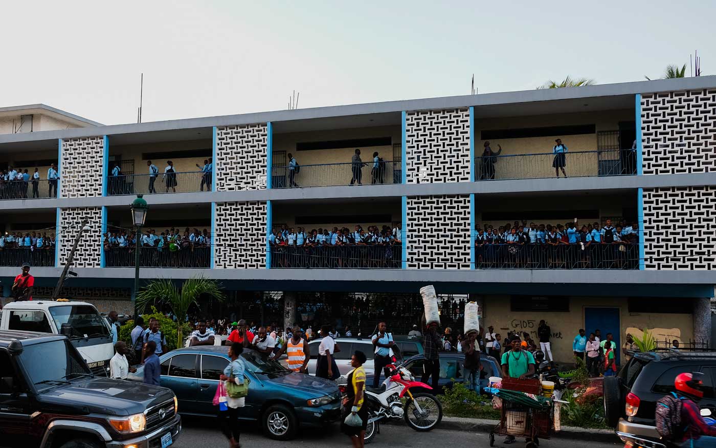 haitian students in public school with street traffic
