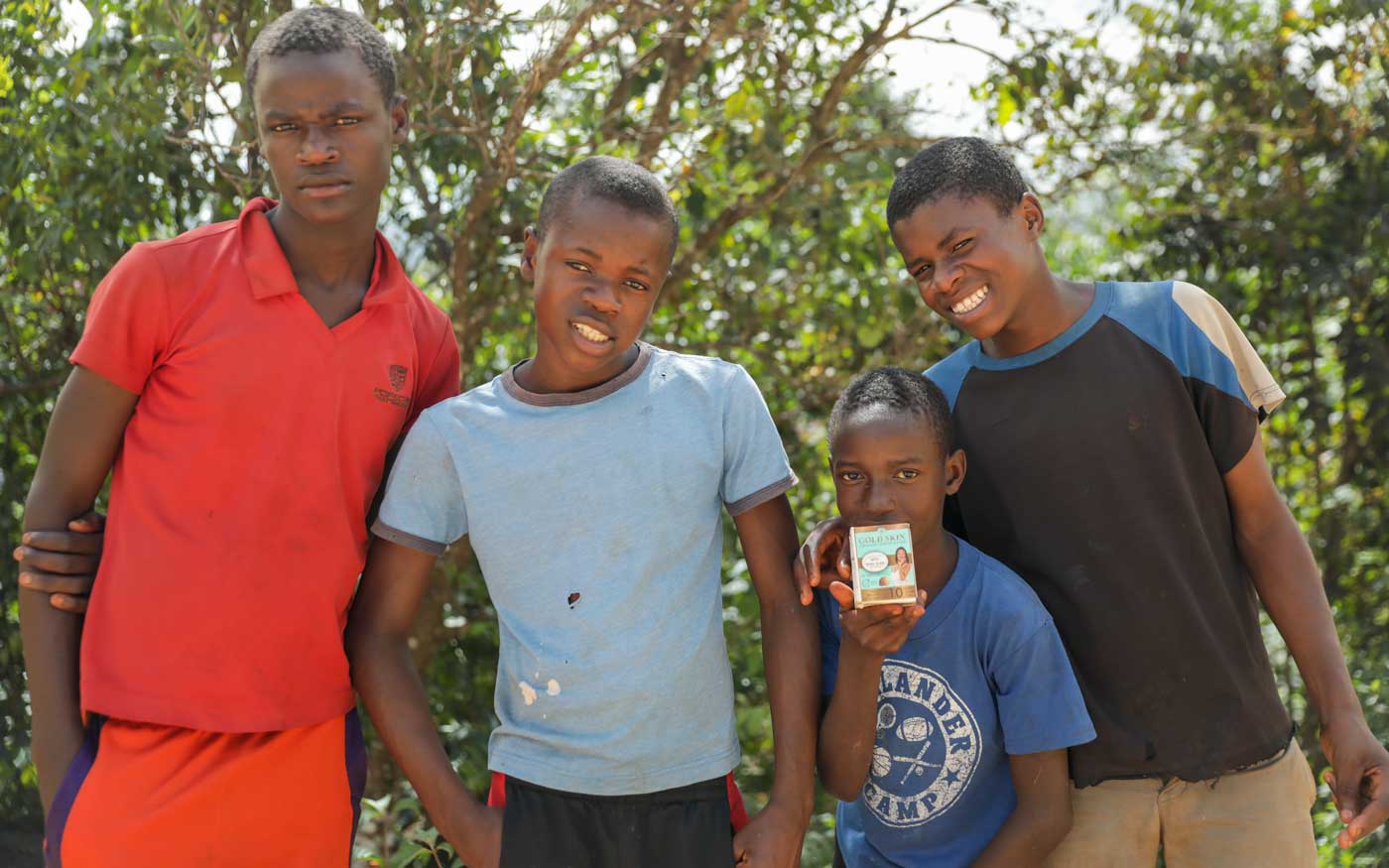 four haitian boys posing for photo