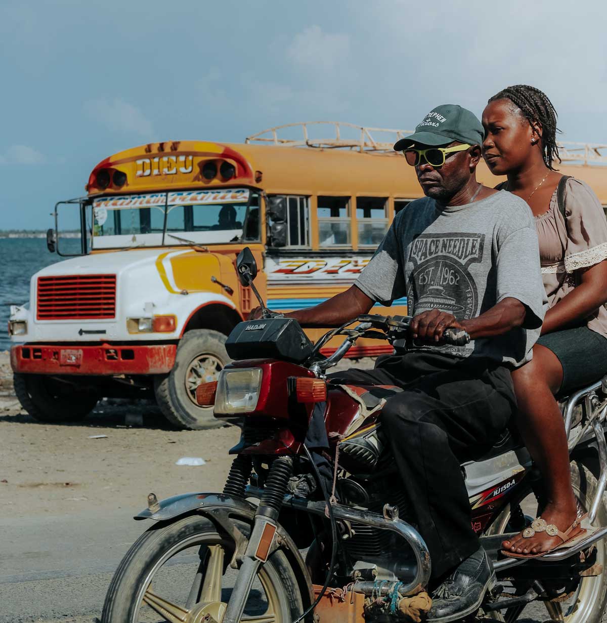 haitian bus and motorcyle with passanger