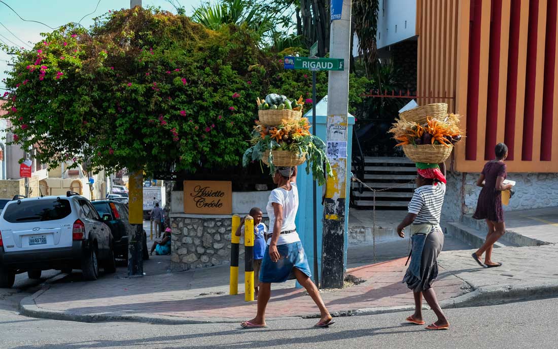 haitian women carrying produce in baskets on their heads