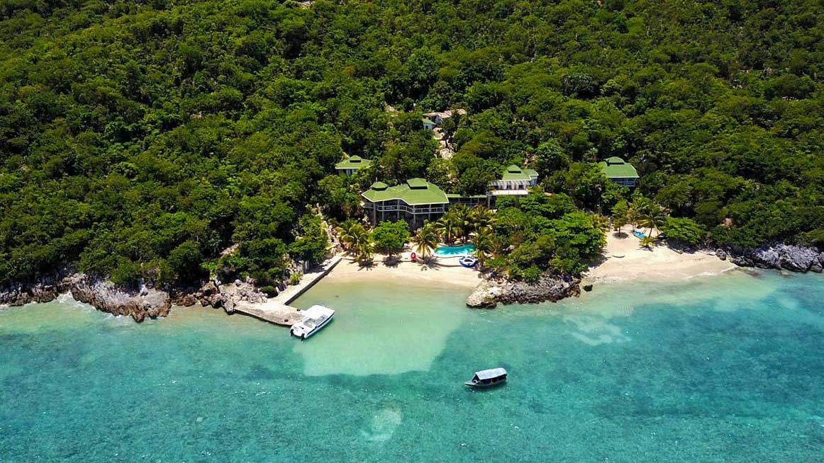 hotel resort on haitis coast with private beach sourounded by forest