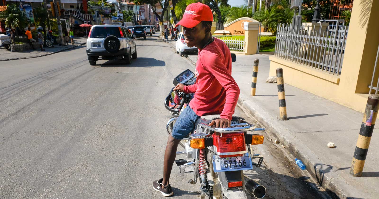 Motocycle driver smiling in Petion-Ville, Port-au-Prince, Haiti